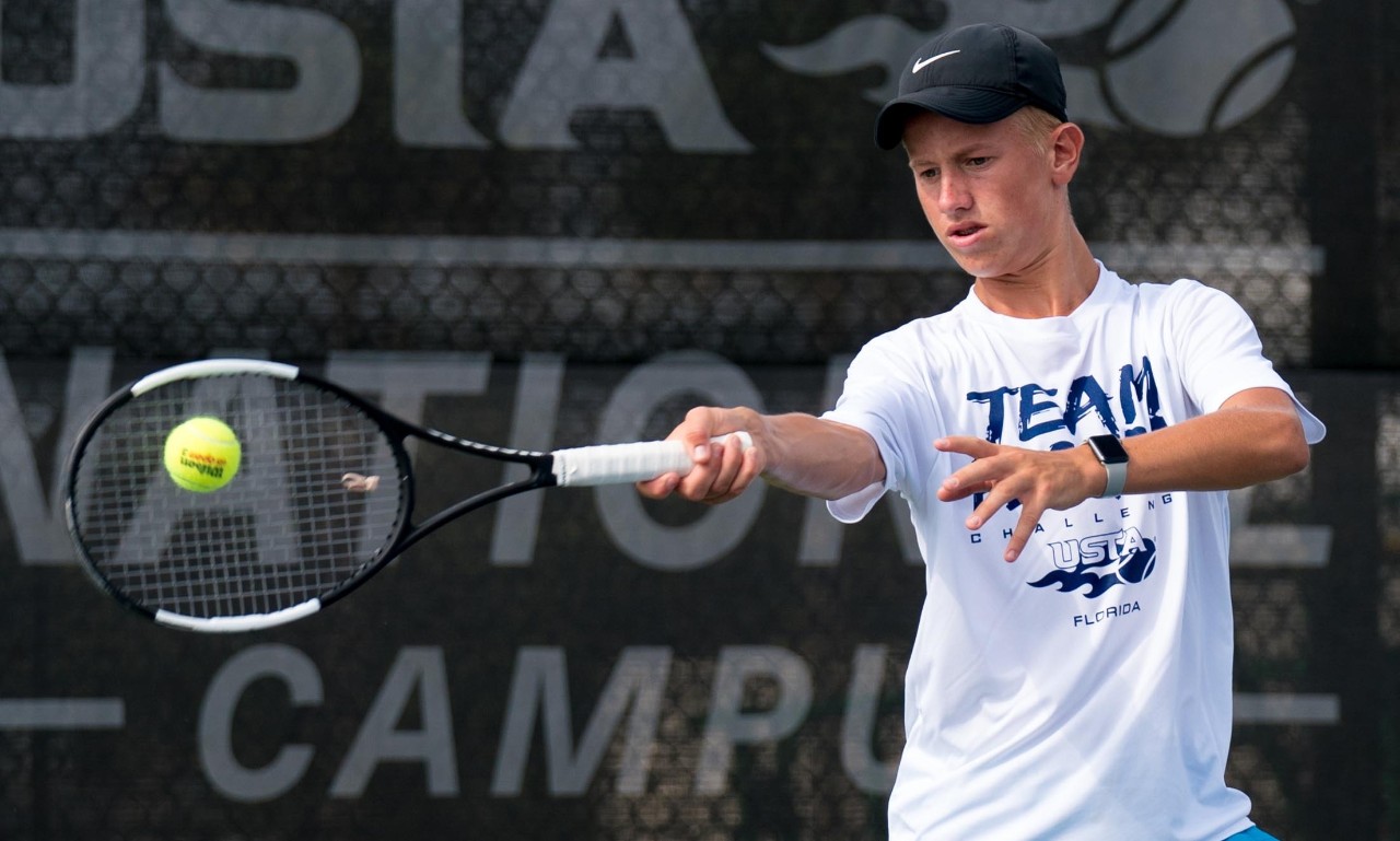 Young girl playing tennis at the USTA National Campus.