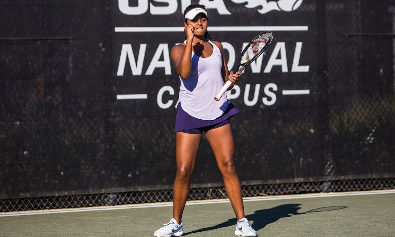 Young girl playing tennis at the USTA National Campus.