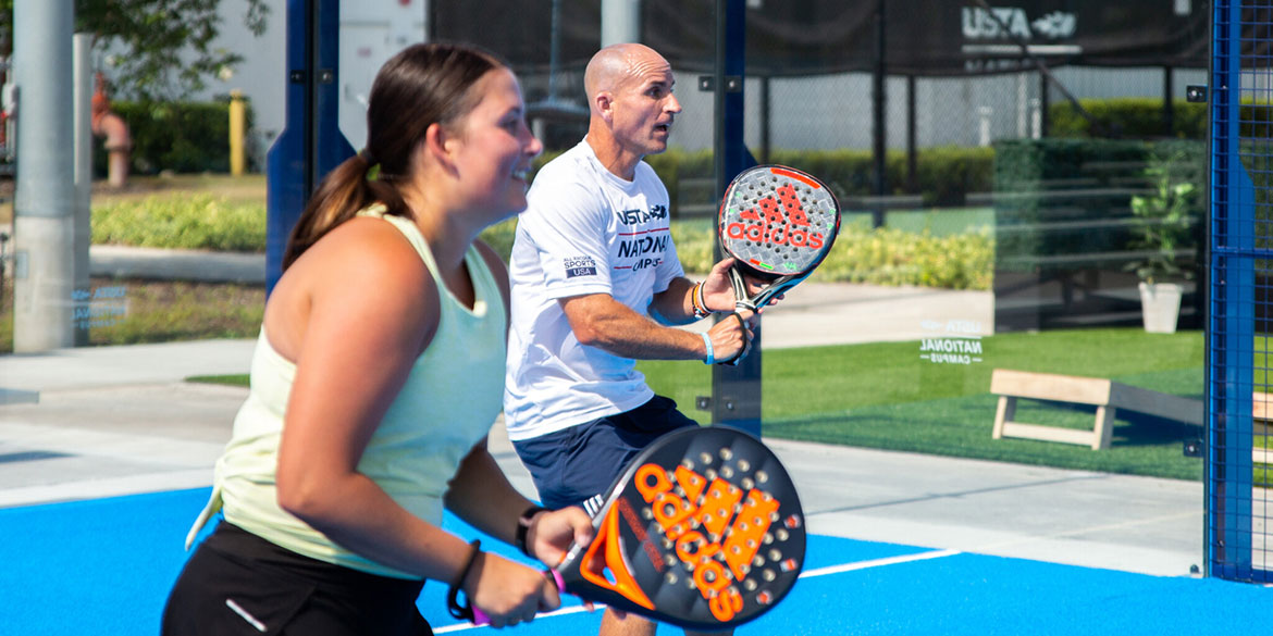 People playing tennis at the USTA National Campus.