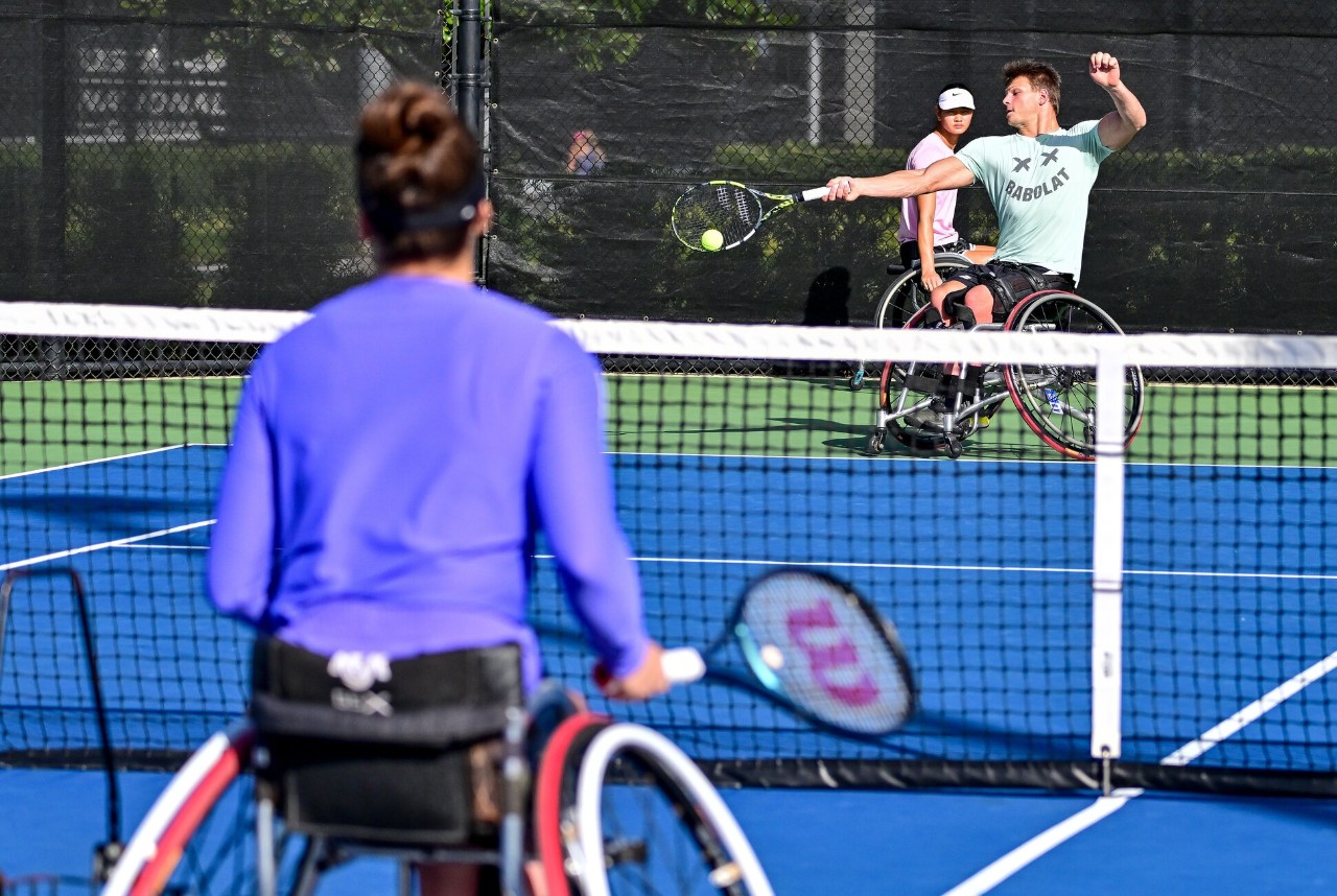 People playing tennis at the USTA National Campus.
