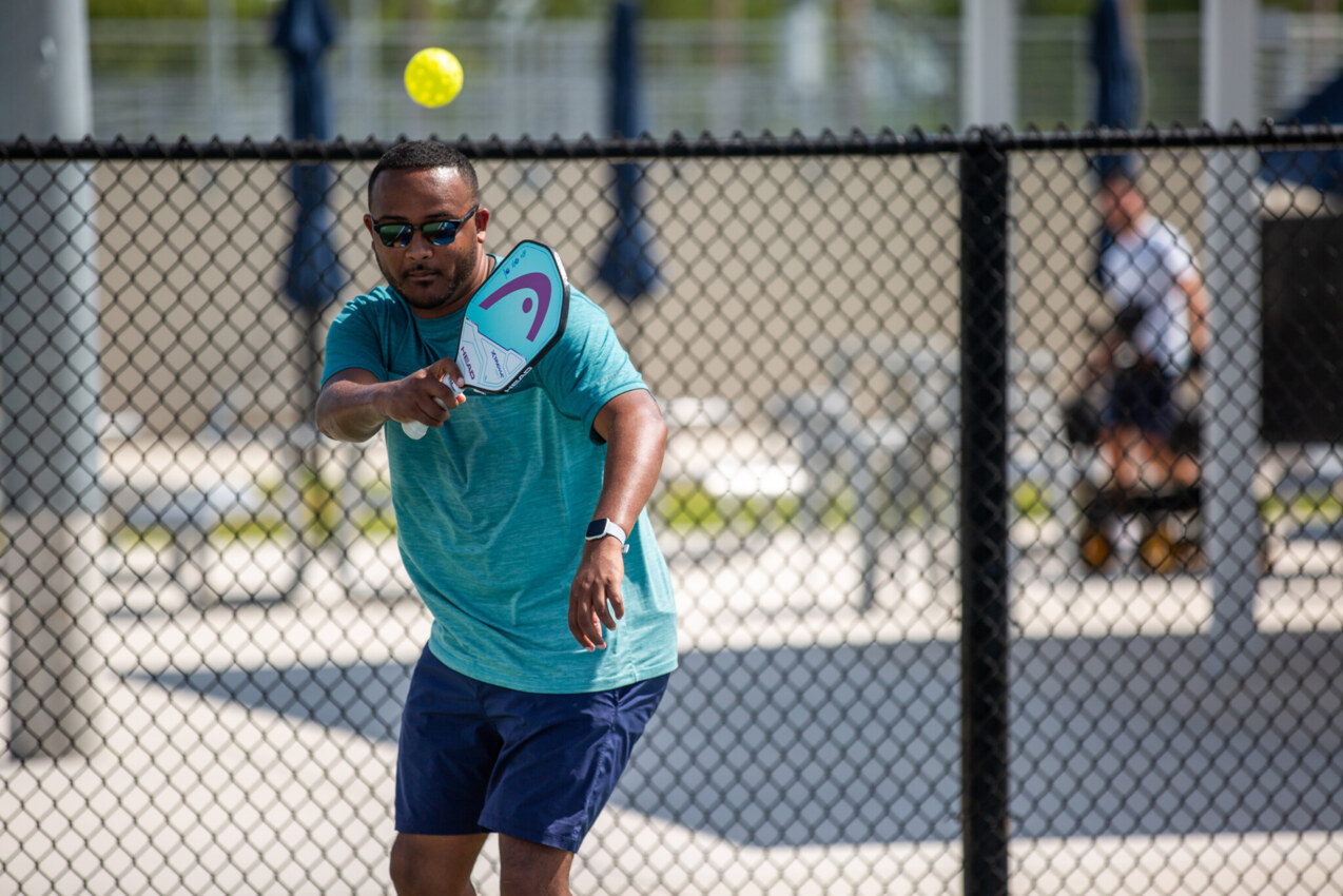 Young boy playing tennis at the USTA National Campus.